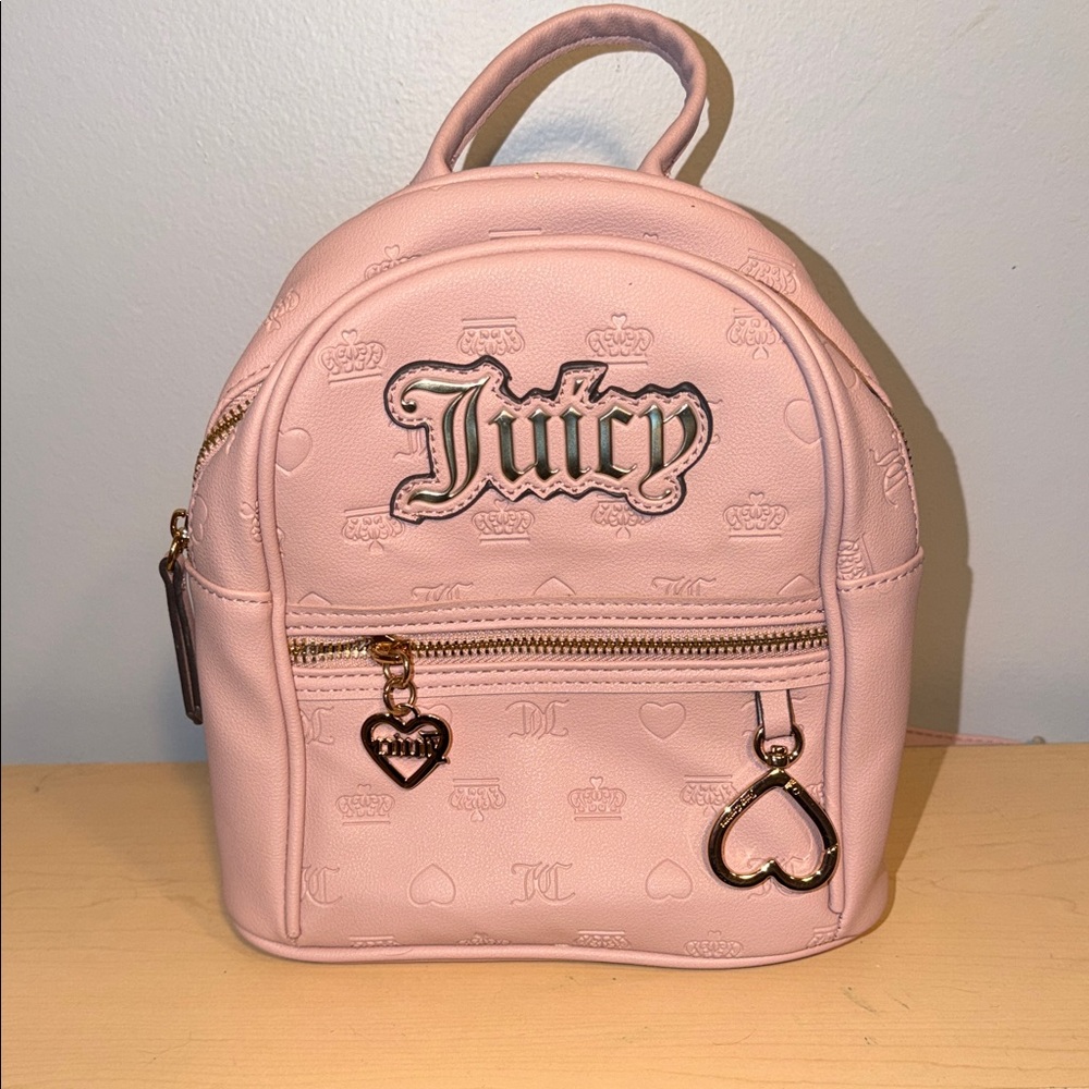 Juicy Couture Ladies Pink Mini Backpack. Gold tone accents.